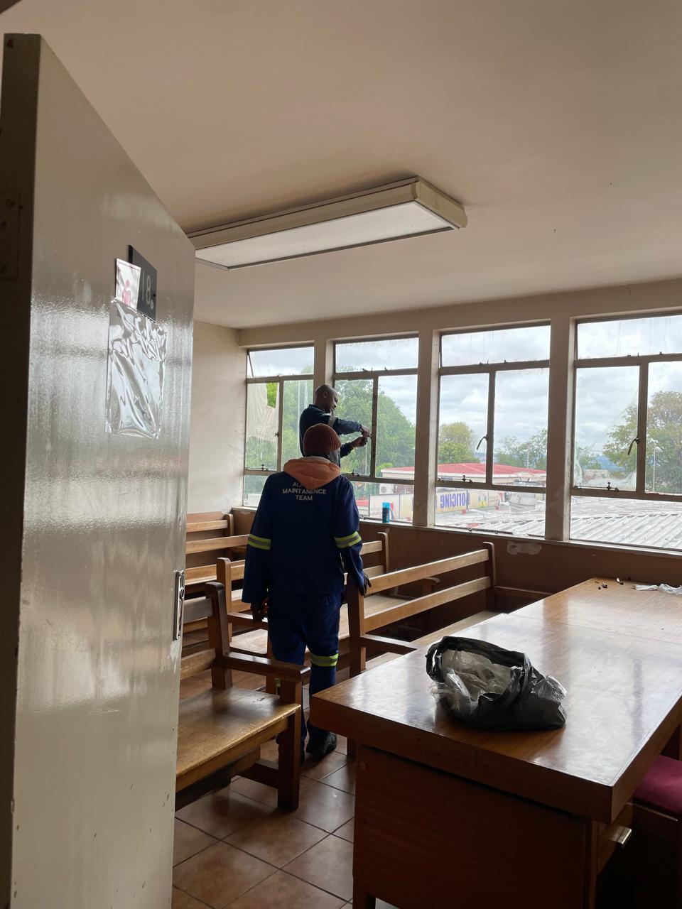 Maintenance team working inside a bright interior space